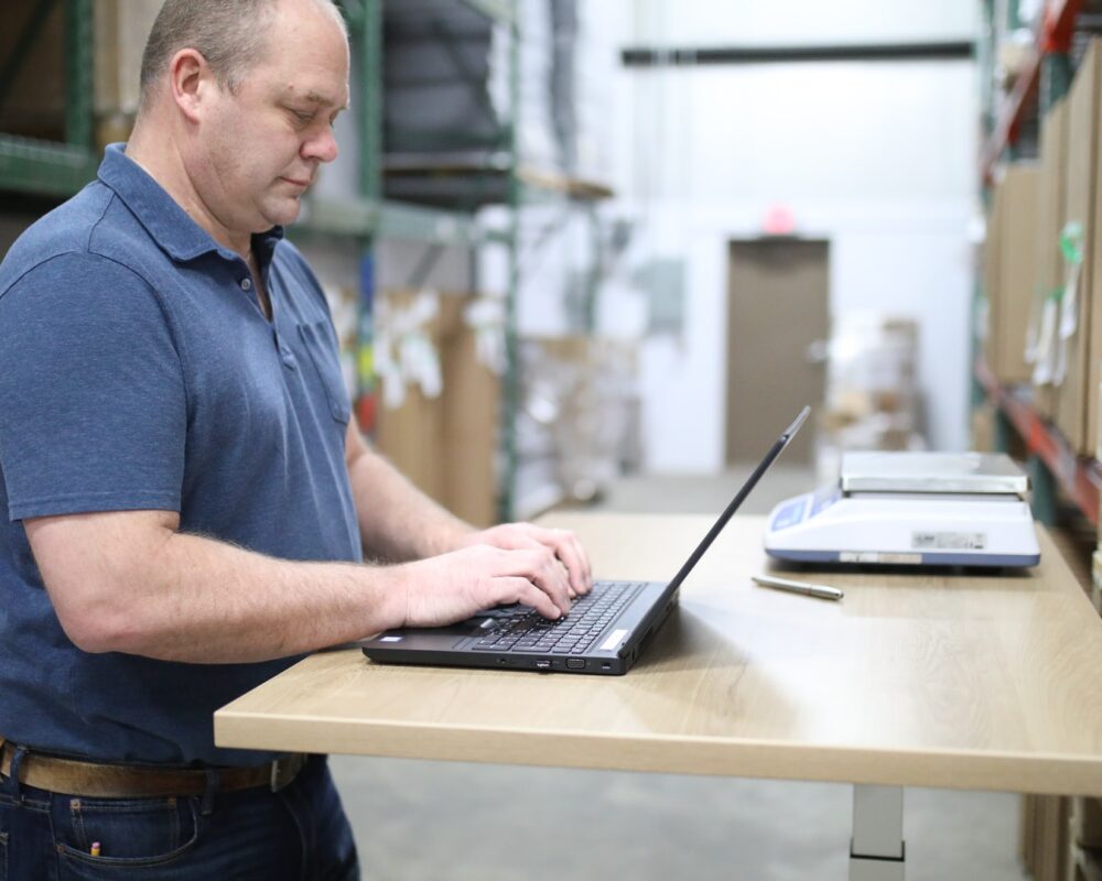 Man on laptop at work