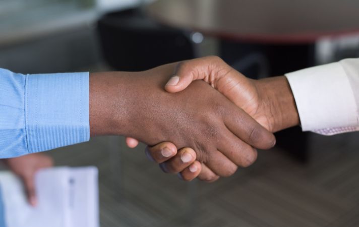 shaking hands of a tenant landlord agreement