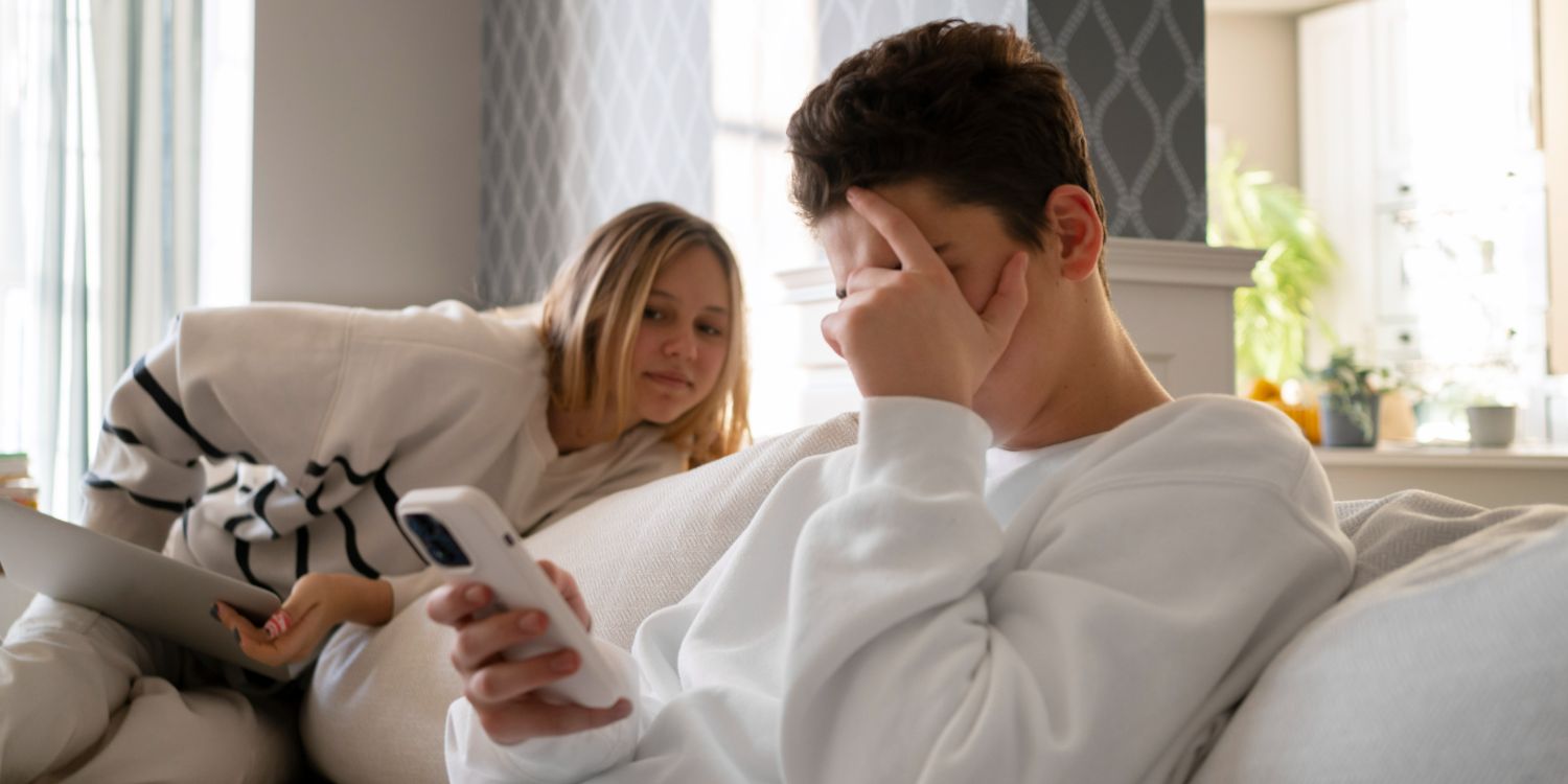 side view boy being cyber bullied