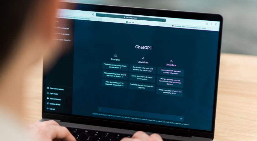 Person using ChatGPT on a laptop to explore AI features for legal tasks and communication