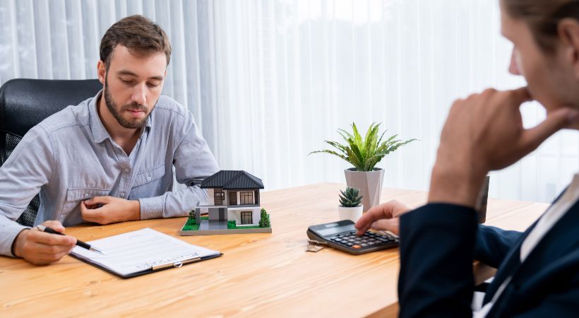 Conveyancer working out the finance for a property 
