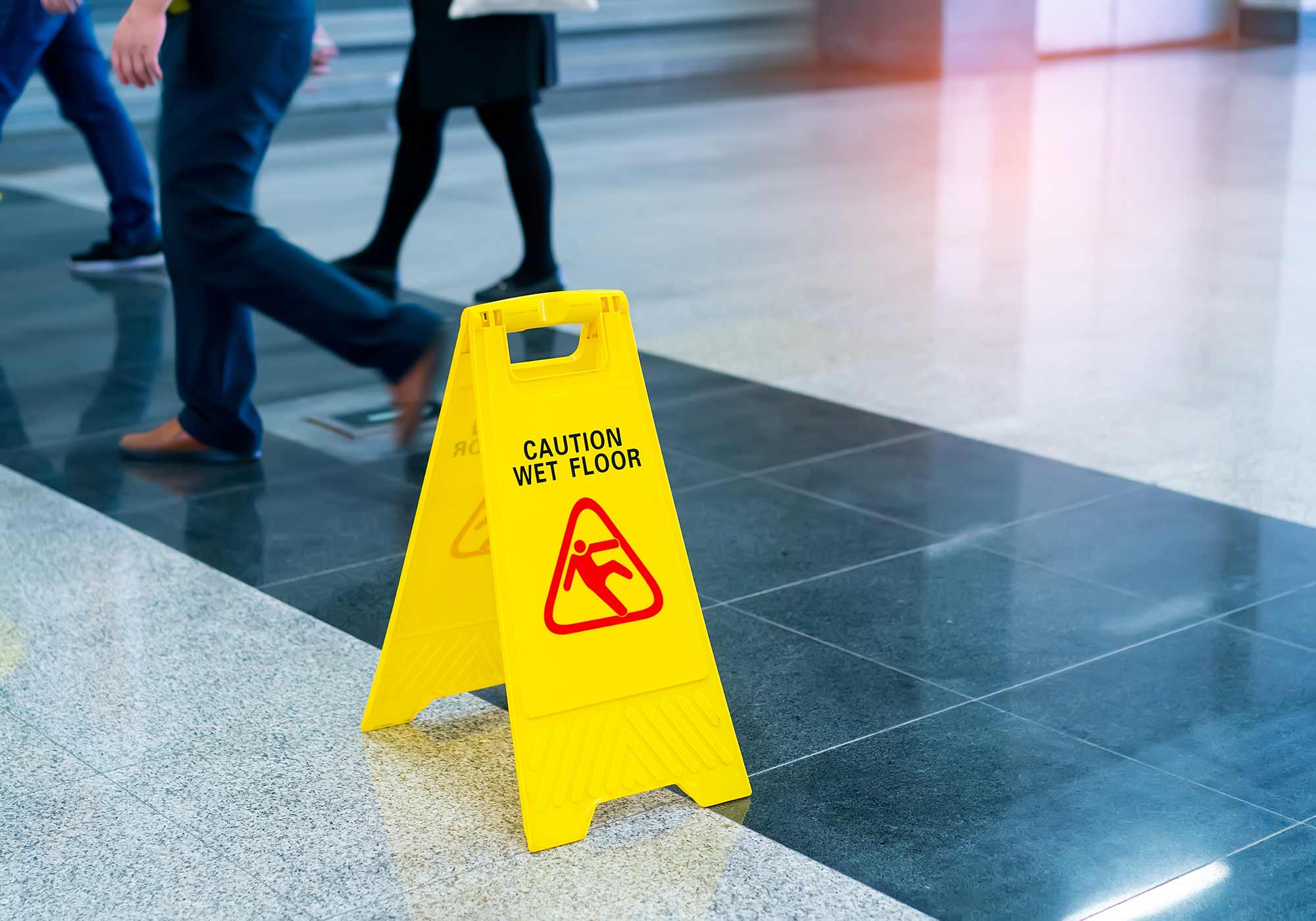 caution wet floor sign in public space