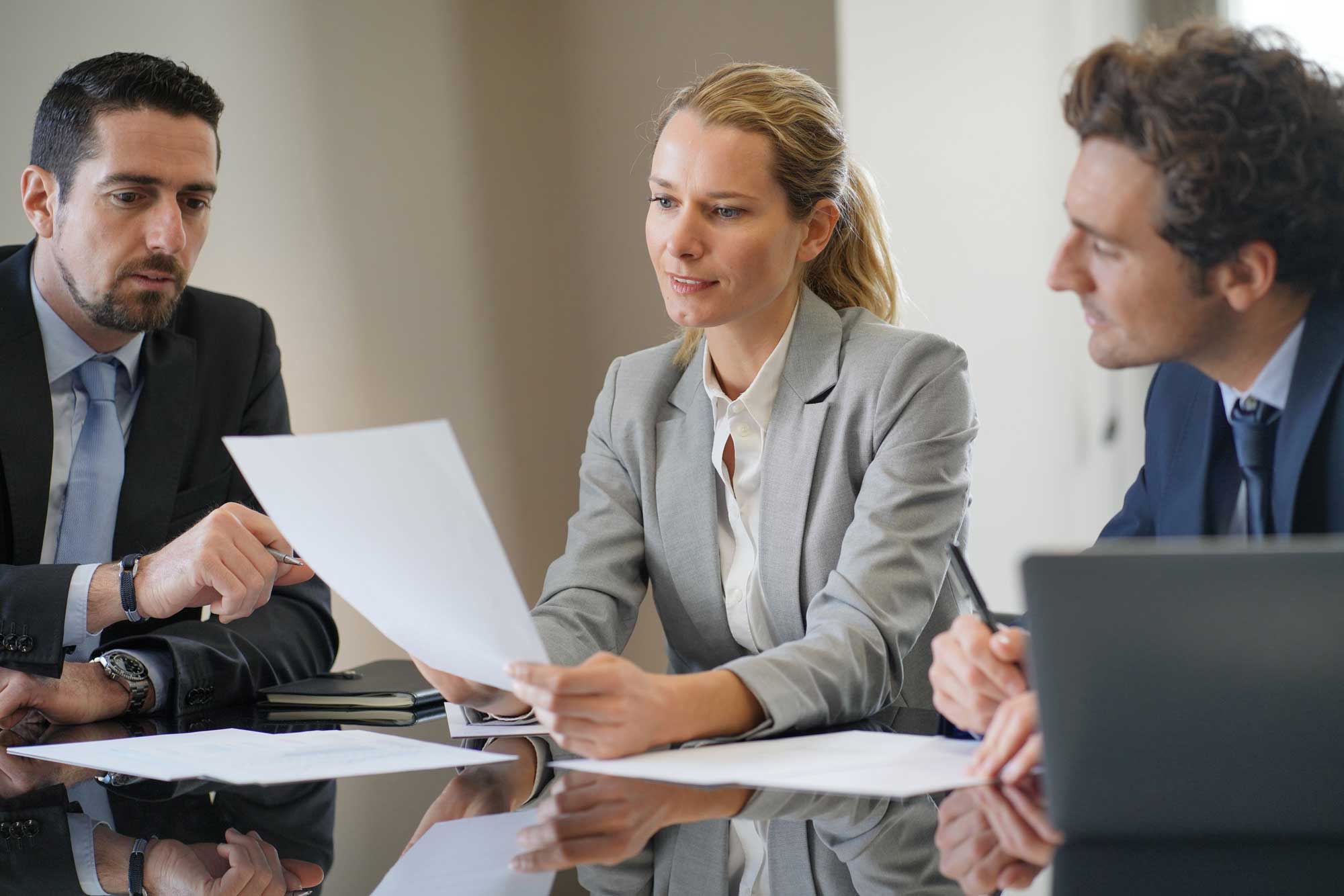 team of business people around a desk