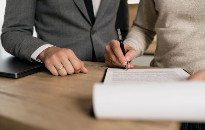 signing a contract to buy someone out of a house