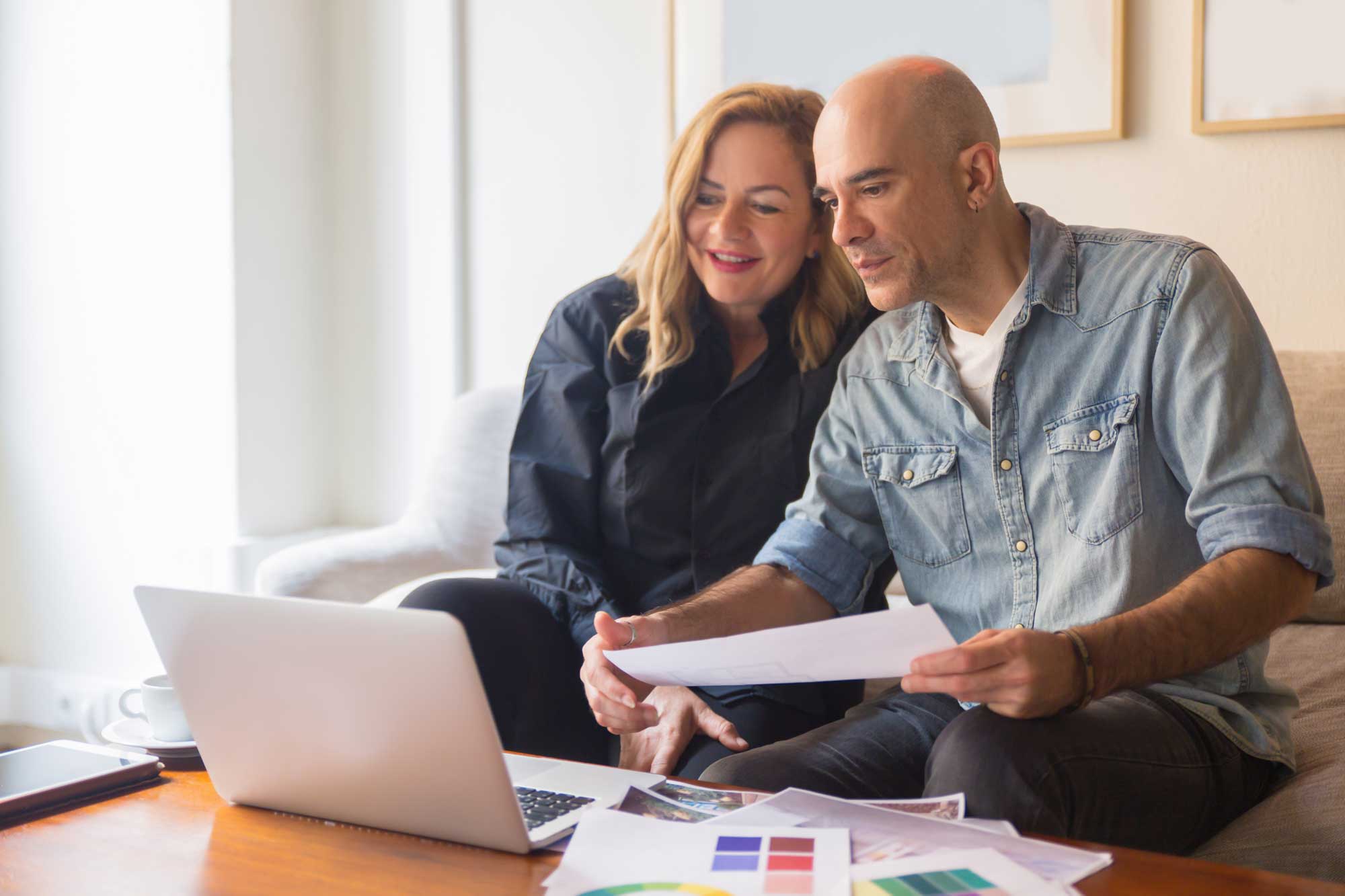 Couple at a table with laptop