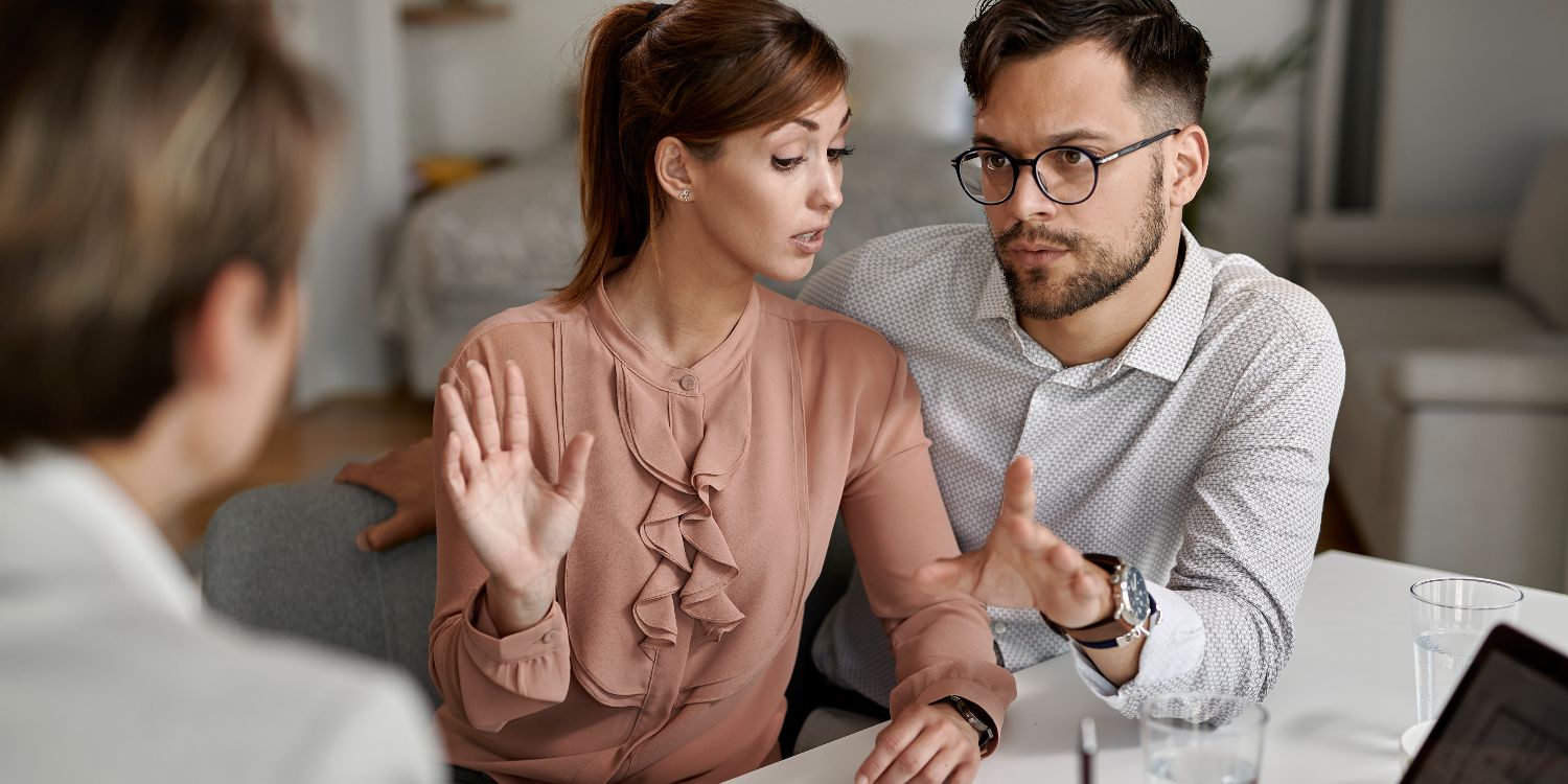 Couple meeting with a solicitor to discuss their financial needs